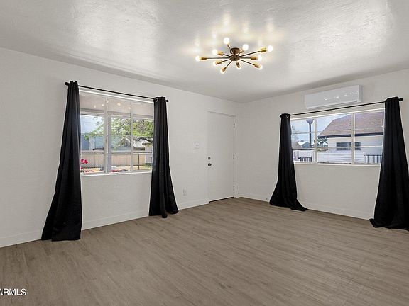 Bright, open living area with stylish LVP flooring _ perfect for relaxing or entertaining.