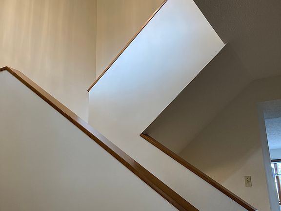 Two story foyer entry and staircase