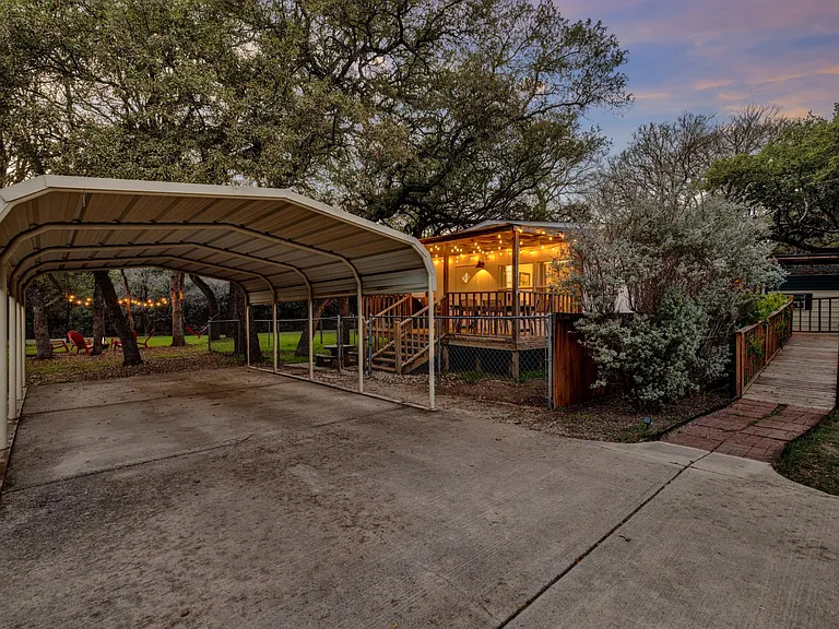 carport parking for one car, plenty more space in the driveway or street for additional parking or boat parking