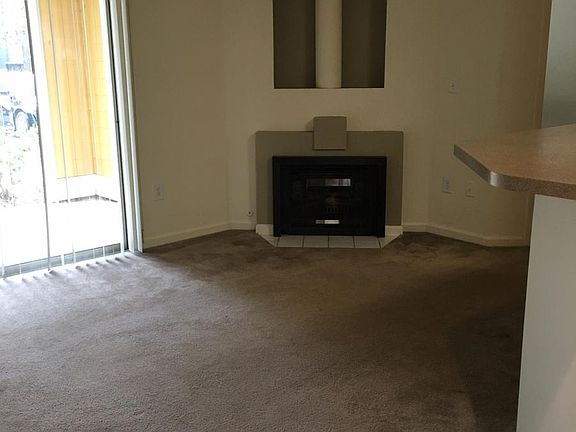 Living Room, Fireplace, Ceiling Fan, Sliding glass doors to