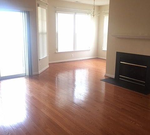 open floor plan living and dining area with gas f/p