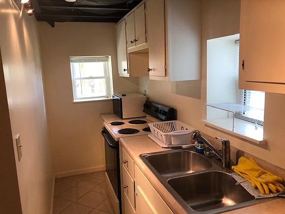 Full kitchen with dishwasher.