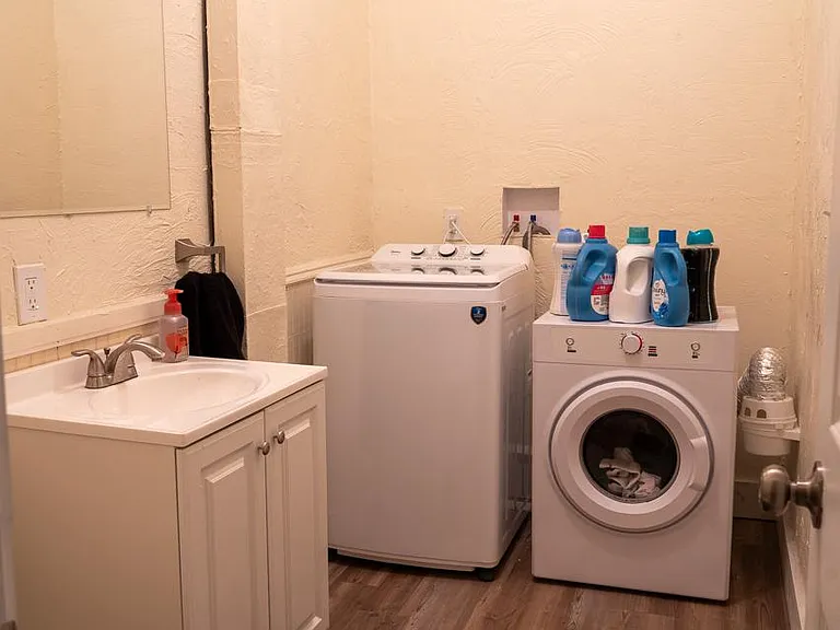 Shared laundry room and guest toilet