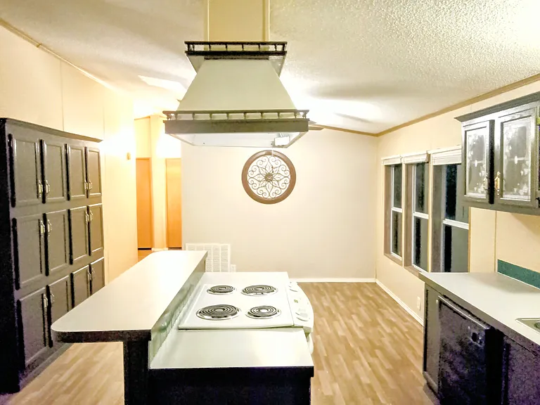 Kitchen area with breakfast nook electrical stove.