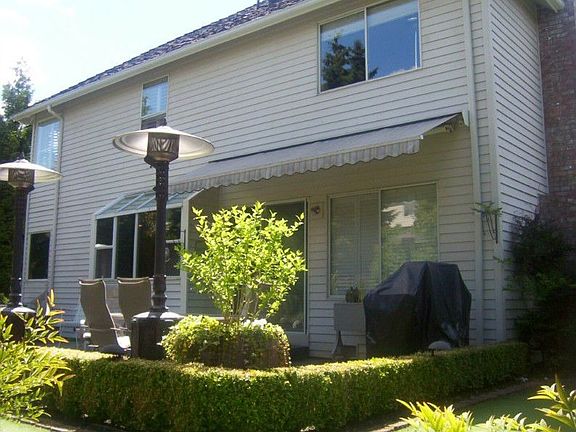 Notice the awning attached to the house... with the push of a button you have shade for your sitting