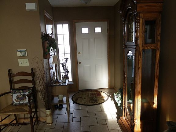 The entry features ceramic tiles, coat closet and entry into the whole house