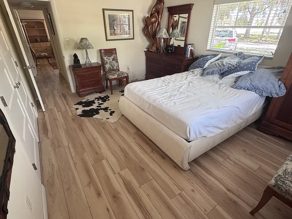Master bedroom (quite large). New luxury vinyl flooring (same as rest of Condo except Kitchen/Master Bathroom/Guest Bathroom; which has a different luxury vinyl flooring).