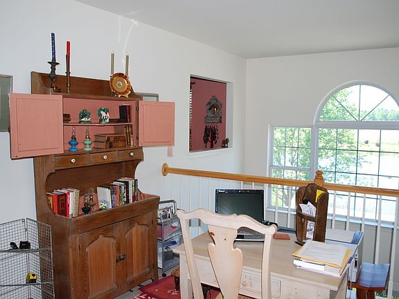 Loft is filled with natural light, and overlooks living area. 