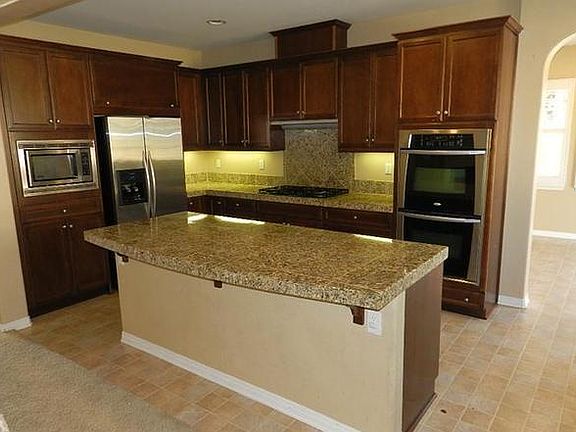 Kitchen Area with island. No Refrigerator in unit.