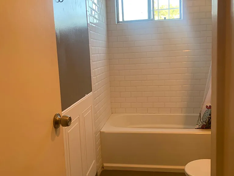 Bathroom with tub and shower
