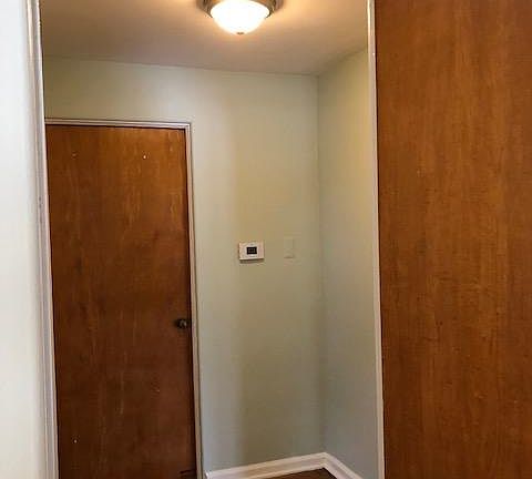 hallway between bedrooms and main bathroom