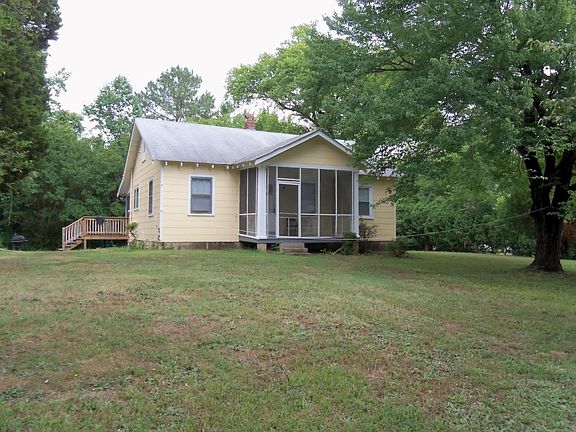 Front of Home with Screen Porch and side deck entrance from back driveway