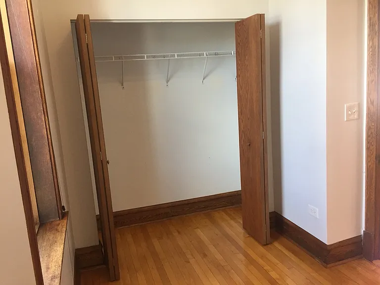 Rear bedroom has a large custom-built closet.