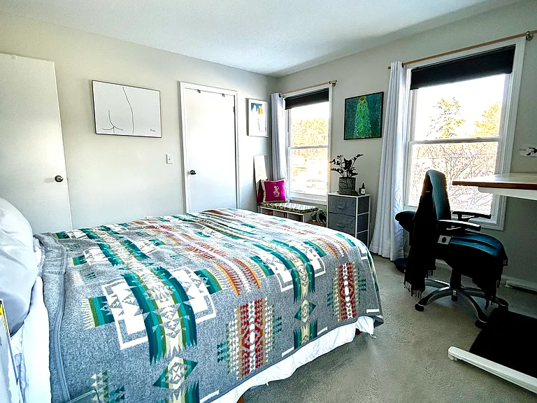 Front bedroom looking outward, sit / stand desk just out of frame