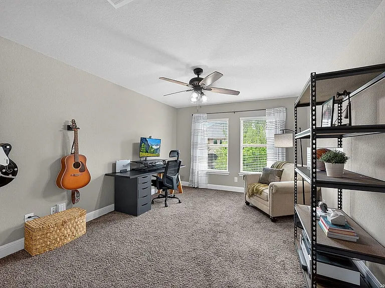 Upstairs room with walk in closet. Can be used as an office, music room, media room, or bedroom.