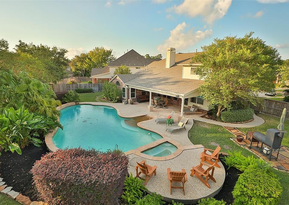 Now this is a backyard. Plenty of room for anyone's favorite sport or laps in the pool! Fully sprinkled and freshly landscaped.