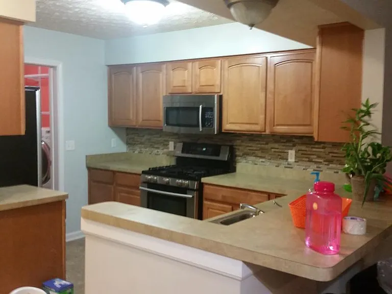 Maple Cabinetry with stainless steel appliances