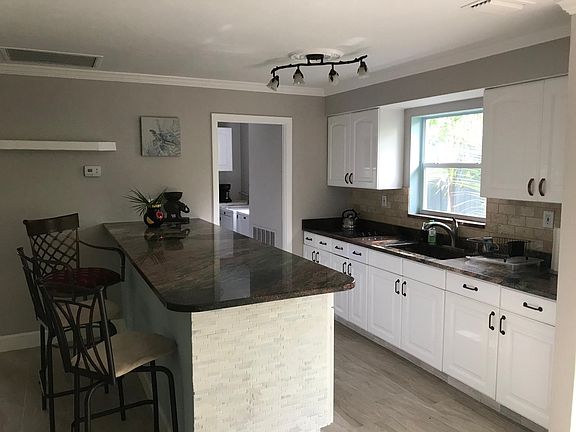 Kitchen with granite counter tops.