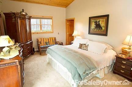 master bedroom w/ vaulted cedar ceiling