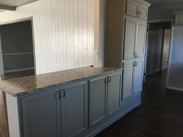 Kitchen Island joins large den on the back of the house for a very open floor plan.