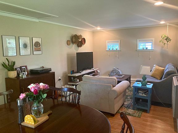 Living room/ dining room area with additional exterior door