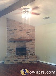 living room fireplace, vaulted ceilings, neutral paint color