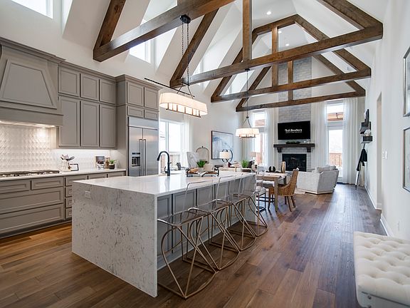 Dramatic beamed ceiling unifies kitchen and great room