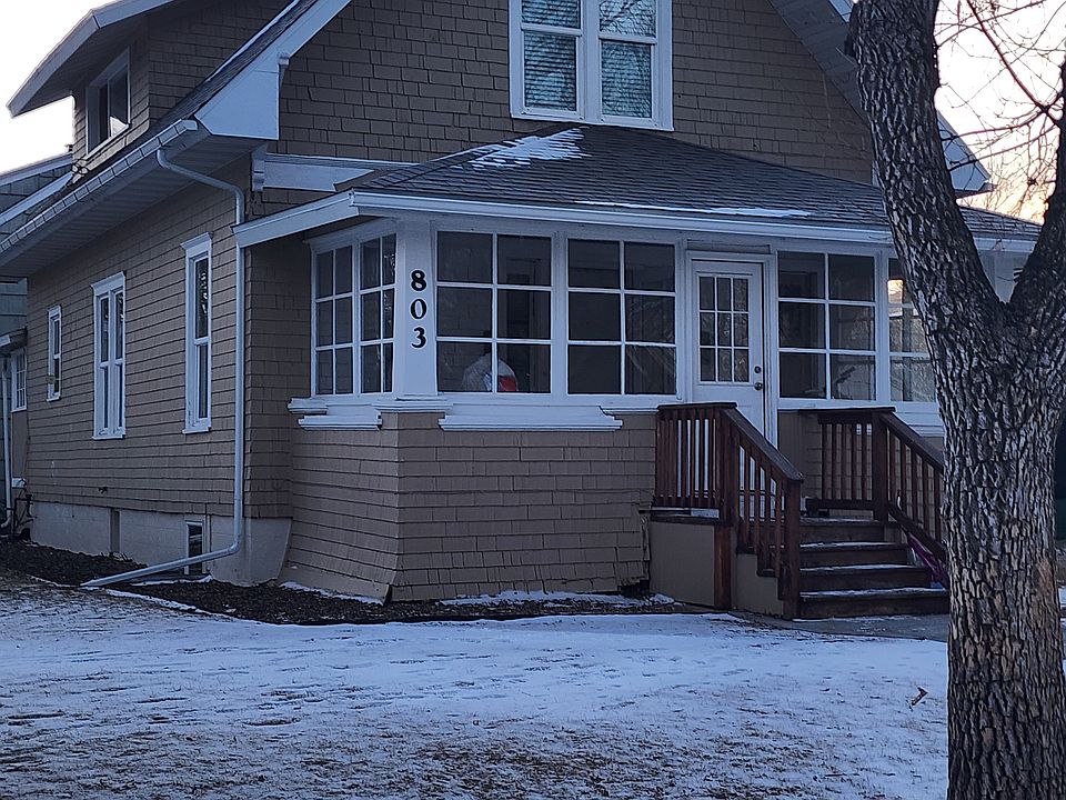 Duplex includes lower main level with shared entrance porch. This apartment is in the upper level with lovely windows.