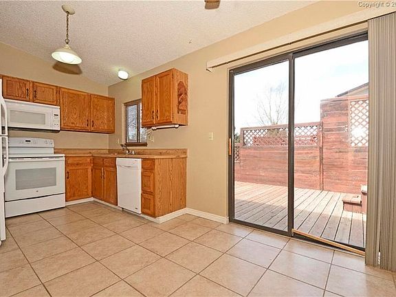 Spacious eat-in kitchen with walkout to deck.