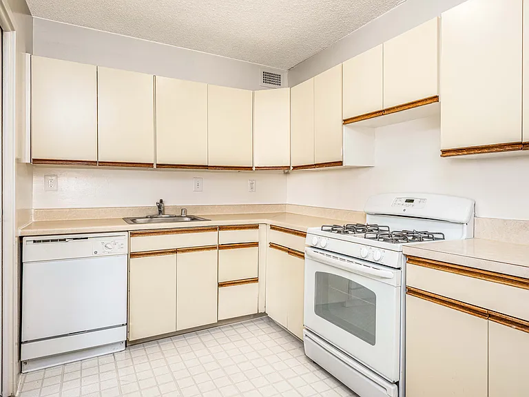 spacious kitchen with plenty of storage and gas range
