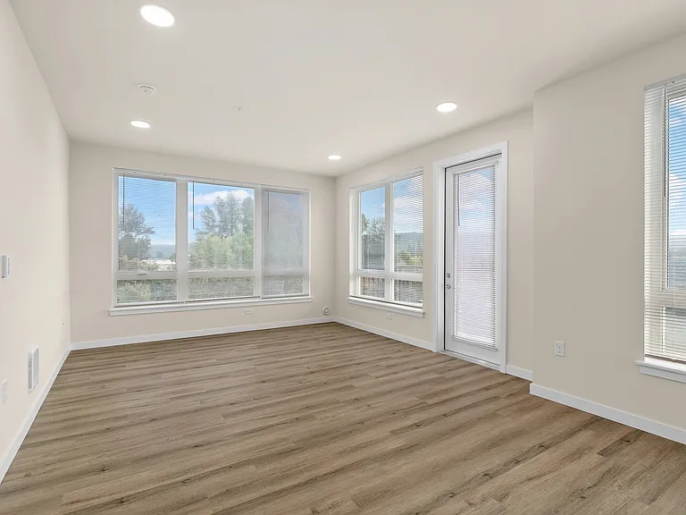 Bright living room with balcony access. Bright living room with balcony access.