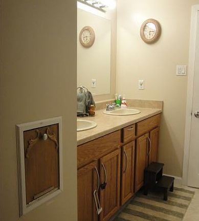 Upstairs bathroom with double sinks & Laundry Chute