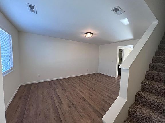 Walk into the living room, or go upstairs to the two bedrooms, two full bathrooms