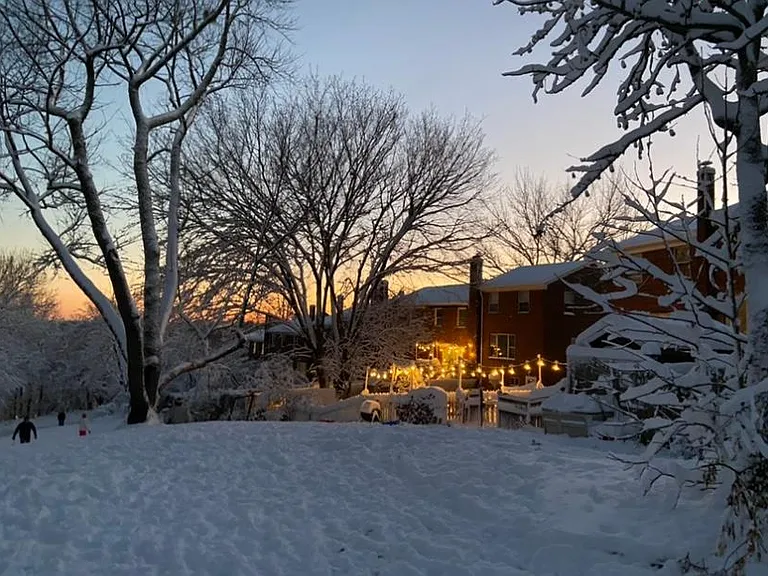 view of backyard during winter - perfect sled hill!