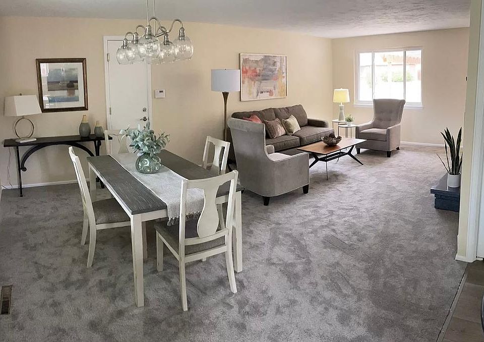 Formal dining and living great area with natural light and fireplace.