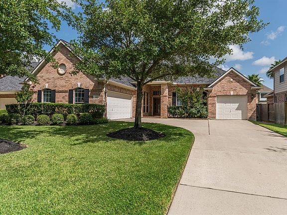 Property features dual bay and single bay three car garage with extra parking.