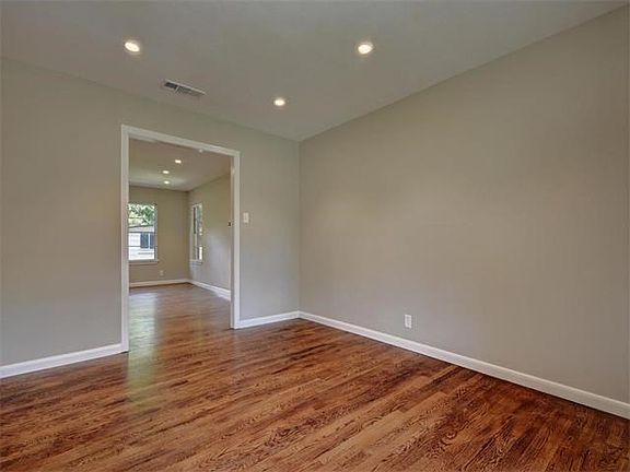 View from formal living area into family room off of kitchen