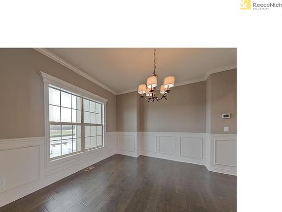 Formal Dining room with wood flooring.
