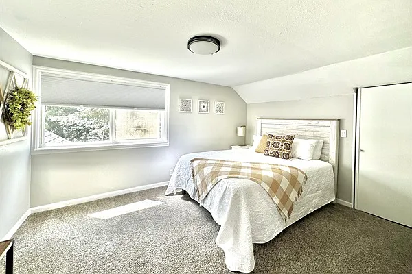 Upstairs primary bedroom with queen bed