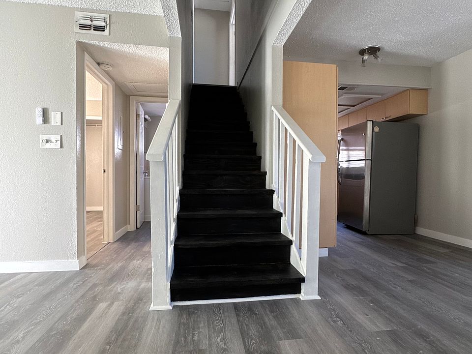First floor spaces include the kitchen, living room a bedroom and a full bathroom.