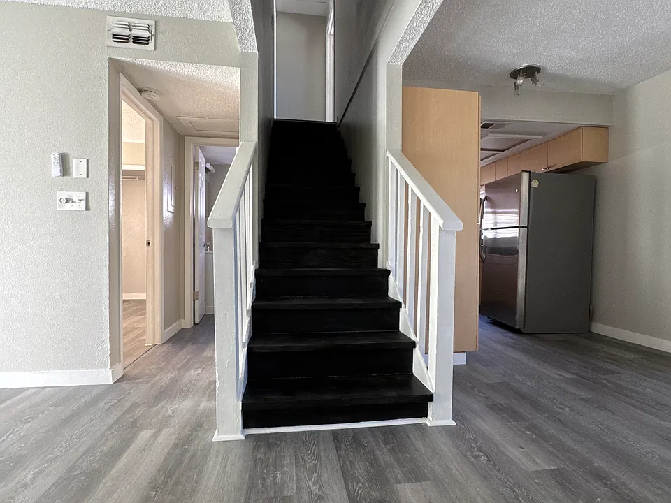 First floor spaces include the kitchen, living room a bedroom and a full bathroom.