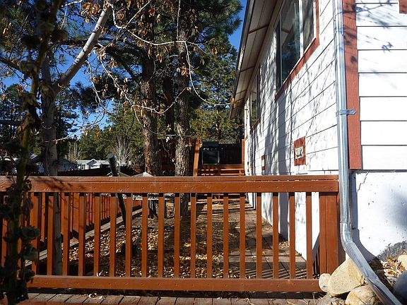 large, multi-level side porch with entrance into home