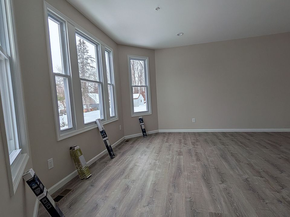 spacious and bright living room and dining room off of the front entrance