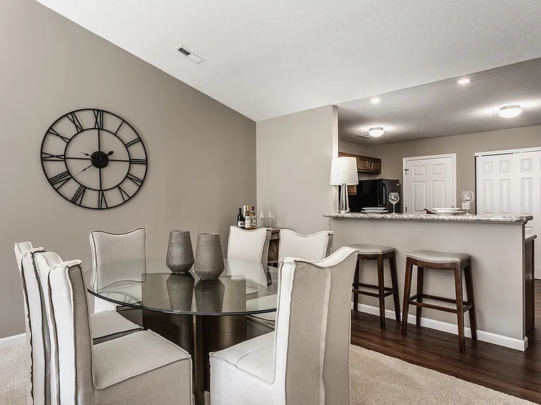 Enjoy meals and gatherings in a spacious dining area that flows seamlessly into the kitchen, designed for both comfort and convenience.