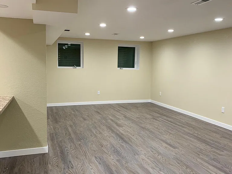 Large Living Room with great lighting which includes dimmers so you can adjust the lighting to your liking.