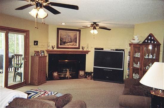 Lower level 22x14' Family Room features ceiling light/fans, and fireplace.