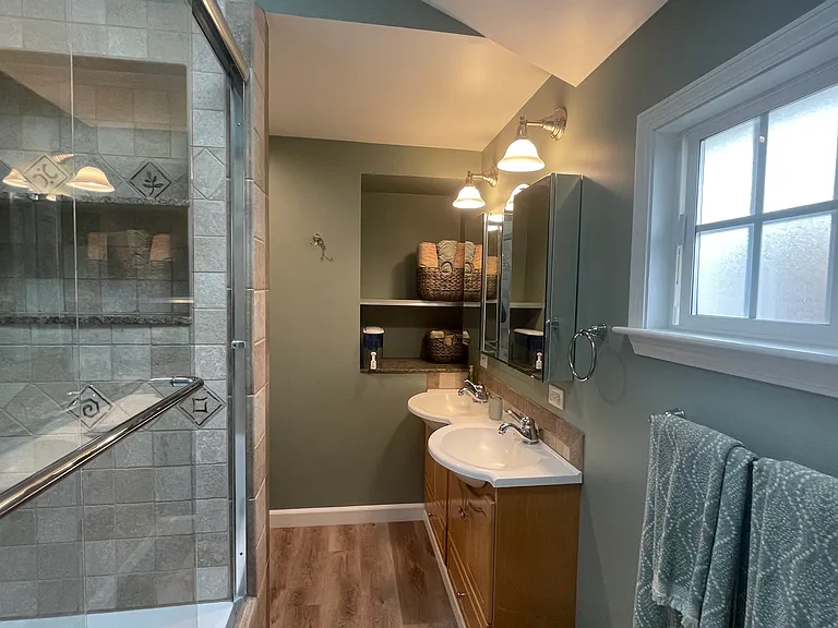 ~Newly remodeled bathroom with dual sinks & a huge shower/tub