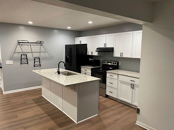 Includes refrigerator, oven, microwave, dishwasher, and garbage disposal.