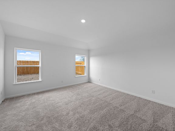 The master suite comes with a private bath and walk-in closet.