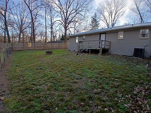 Backyard of residence with fire pit.